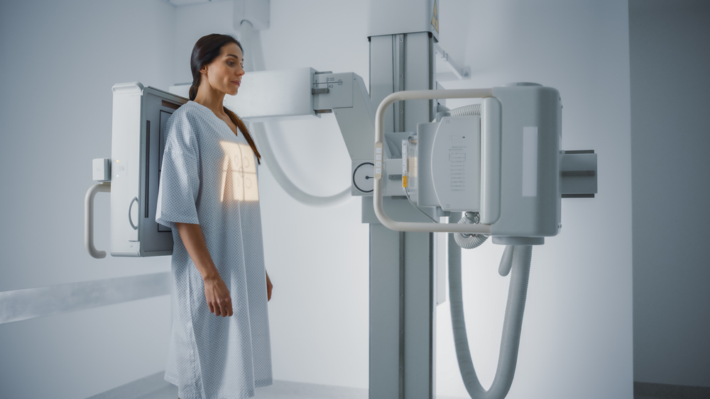 Hospital Radiology Room Beautiful Multiethnic Woman Standing In Medical Gown