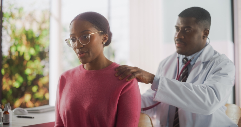 Beautiful Black Female Passing A Health Examination By A Professional