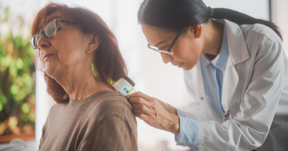 Middle Aged Female Passing A Medical Examination By A Young