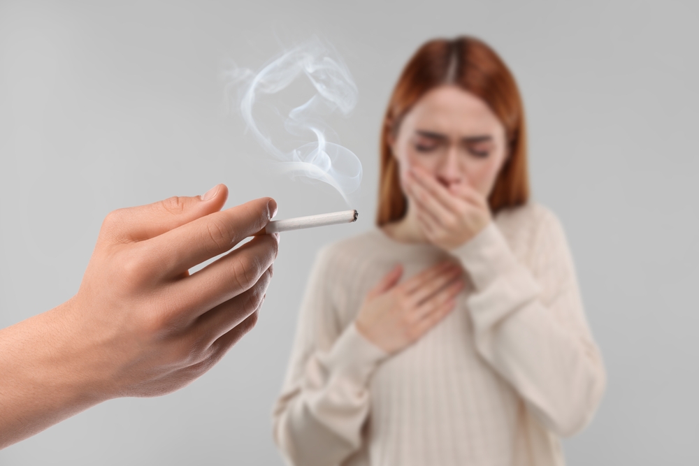 Passive Smoking Woman Coughing Because Of Man Smoking Nearby On