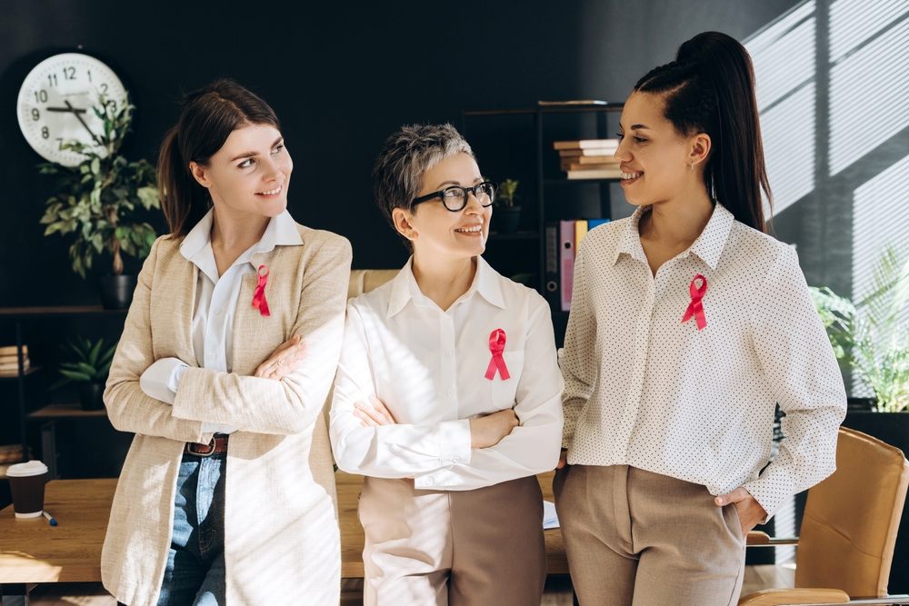 Businesswomen Are Wearing Pink Ribbons On Their Shirts Demonstrating Their
