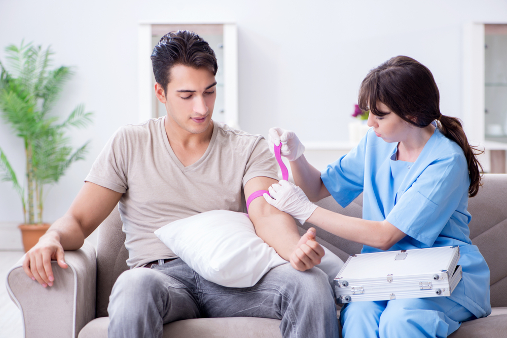 Patient Getting Blood Transfusion In Hospital Clinic