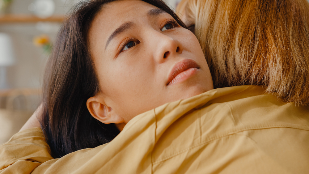 Sad Young Asian Woman Hug Cuddle Embracing With Best Friend