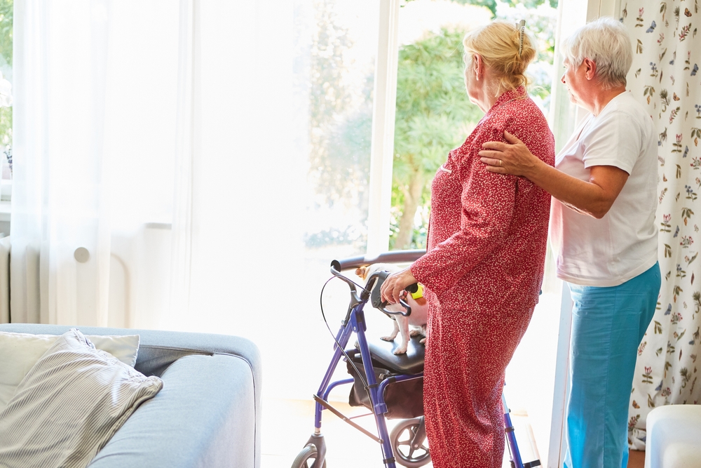 Elderly Woman After A Stroke With A Walker At The