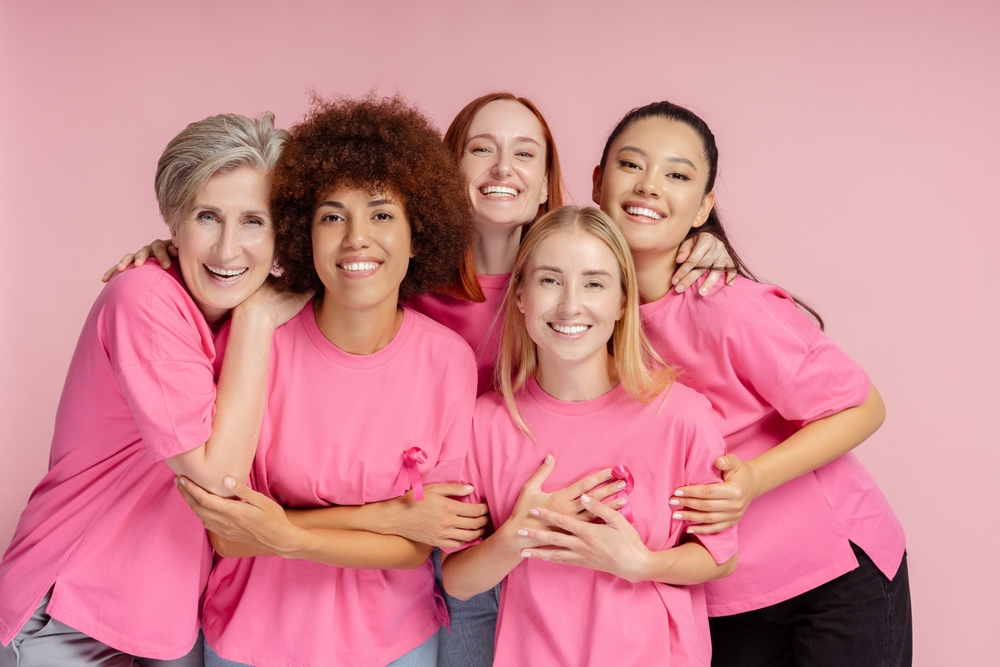 Group Of Smiling Confident Multiracial Women Wearing T Shirts With