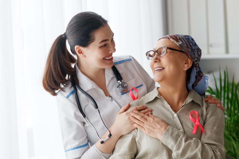 Pink,Ribbon,For,Breast,Cancer,Awareness.,Female,Patient,Listening,To Pink Ribbon For Breast Cancer Awareness. Female Patient Listening To