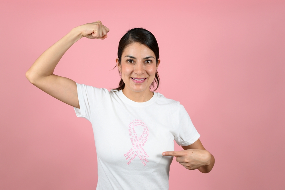 Woman Pointing At The Symbol Of Fight Against Breast Cancer