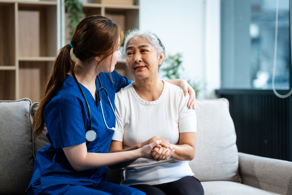 A Young Asian Nurse Only Woman Present Holds Hands With