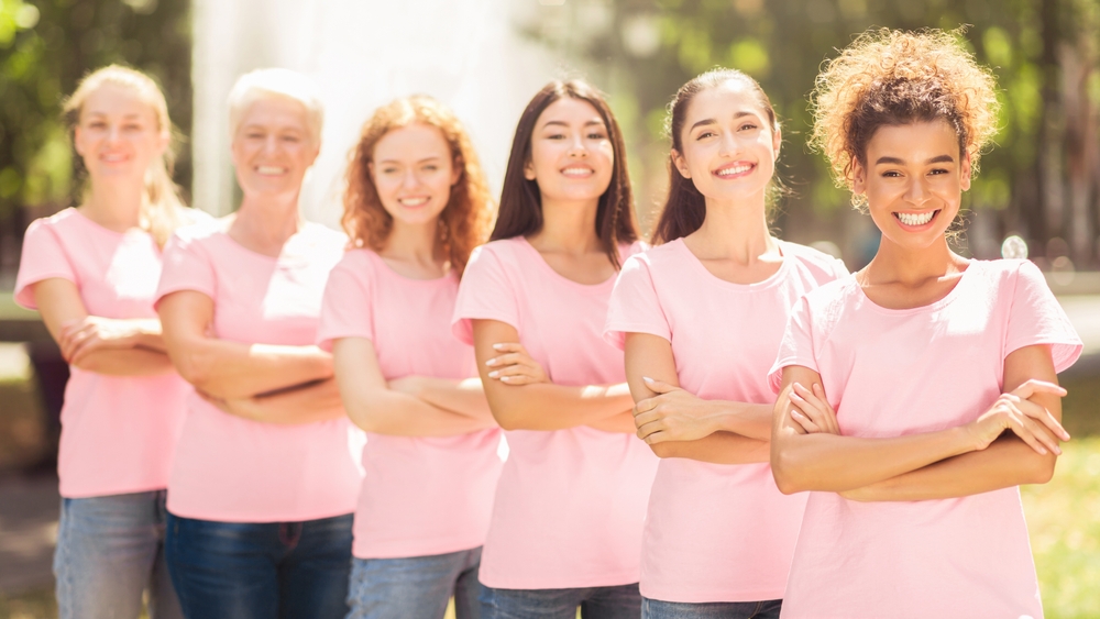 Breast Cancer Survivors. Happy Ladies In Pink T-shirts With Cancer
