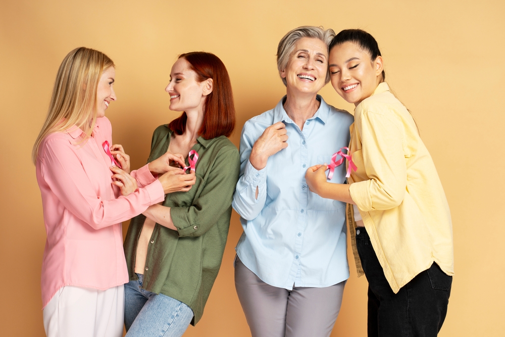 Four Diverse Women Of Different Ages Are Smiling And Wearing