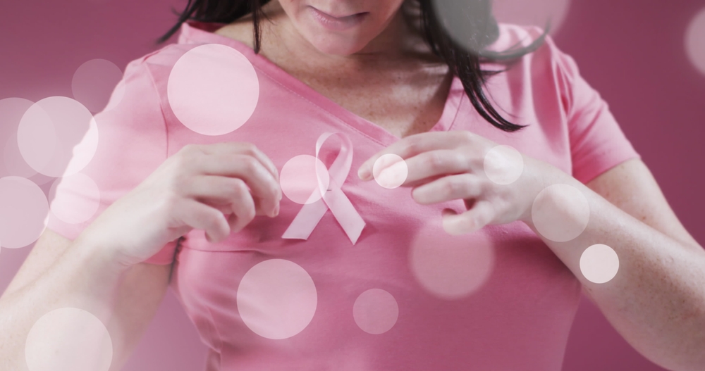 Of Light Spots Over Caucasian Woman With Pink Ribbon