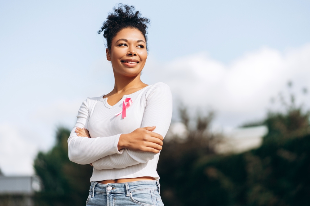 Portrait Of Young African American Woman With Crossed Arms Posing