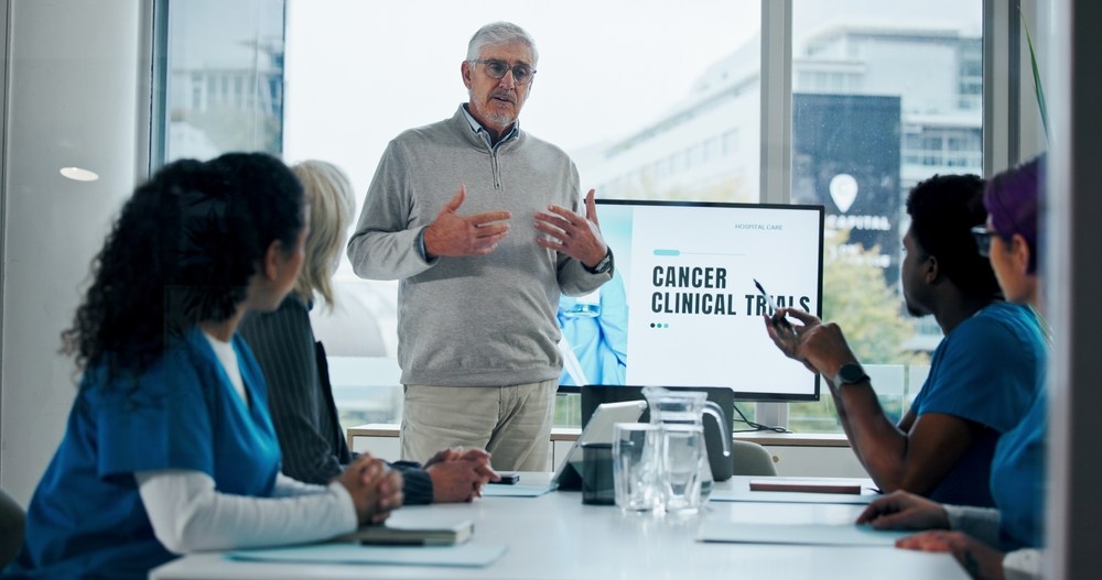 Man Meeting And Presentation With Medical Team For Cancer Awareness