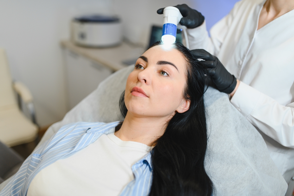 Doctor Diagnoses The Structure Of The Hair. Consultation With A