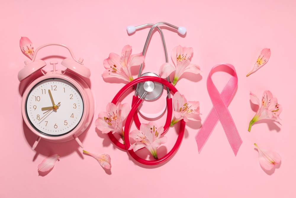 Pink,Alarm,Clock,,Stethoscope,,Ribbon,,And,Flowers,Arranged