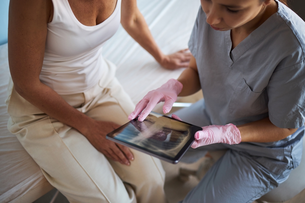 Middle Aged Caucasian Woman Sitting Beside Young Adult Caucasian Female