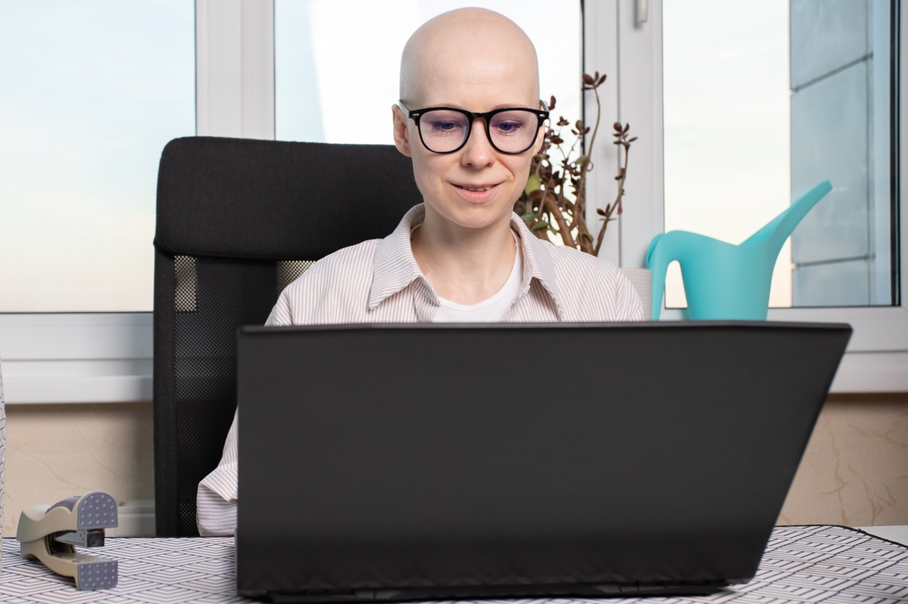 Woman In Striped Shirt And Eyeglasses Working Computer At