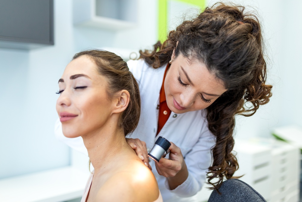 Dermatologist Skin Cancer Screening. Doctor Using Dermatoscope To Check Mole