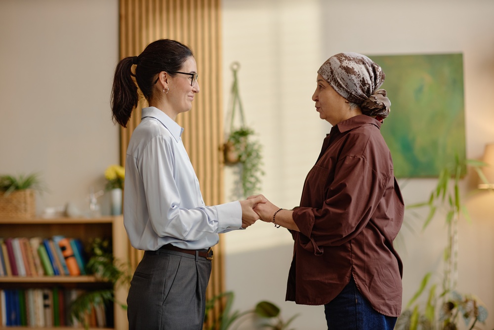 Middle Aged Caucasian Woman Holding Hands With Middle Aged Woman