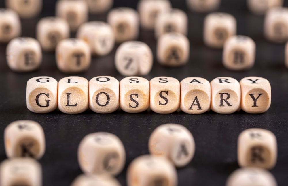 Glossary - Word From Wooden Blocks With Letters Alphabetical List