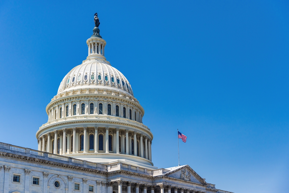The United States Capitol Building With American Flag Washington Dc