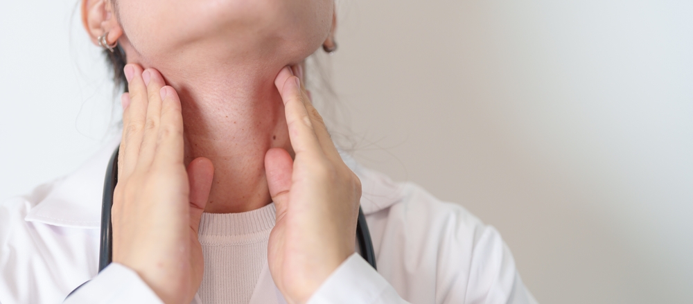Woman Checking Thyroid Gland Disease. Hand Holding Neck Pain. Hyperthyroidism
