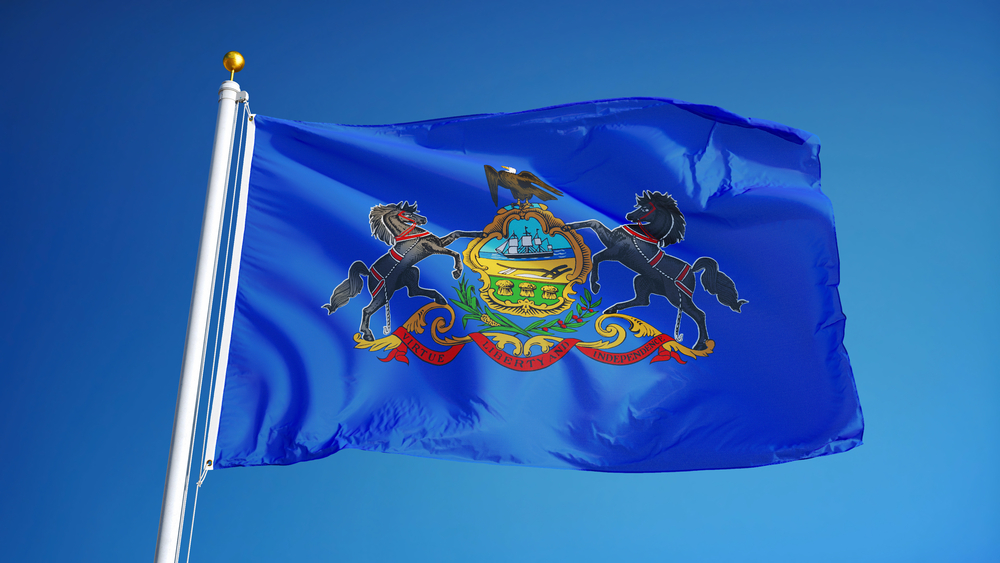 Pennsylvania,(u.s.,State),Flag,Waving,Against,Clear,Blue,Sky,,Close Pennsylvania (u.s. State) Flag Waving Against Clear Blue Sky Close