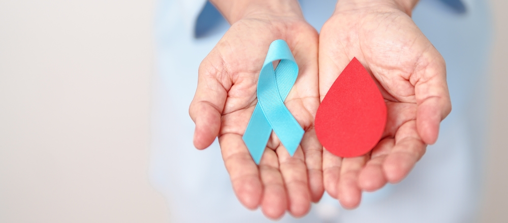 Elderly Woman With Blue Ribbon And Red Blood Drop For